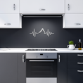 Load image into Gallery viewer, Pilates_Heart_Sign_Metal_Silver_Dark_Kitchen_Mockup.png